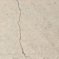 What is considered a hairline crack in concrete?