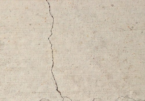 What is considered a hairline crack in concrete?